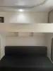 Кровать двухъярусная с диваном.