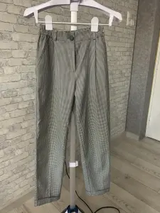 Зауженные женские брюки в клетку