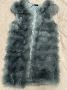 Жилетка меховая