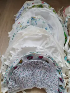Чепчики новые около 70 шт. Цена за штуку.