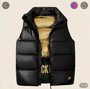 Жилет пуховик